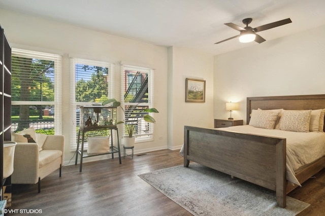 bedroom featuring ceiling fan and dark hardwood / wood-style floors