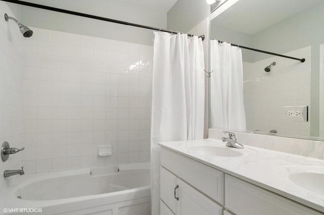 bathroom featuring vanity and shower / tub combo