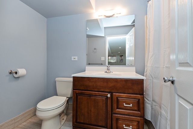 bathroom with tile patterned floors, vanity, and toilet