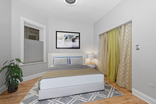 bedroom featuring hardwood / wood-style flooring