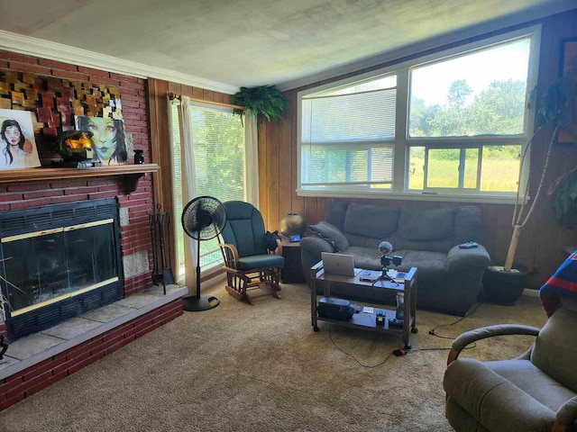 living room with carpet flooring, ornamental molding, and a fireplace