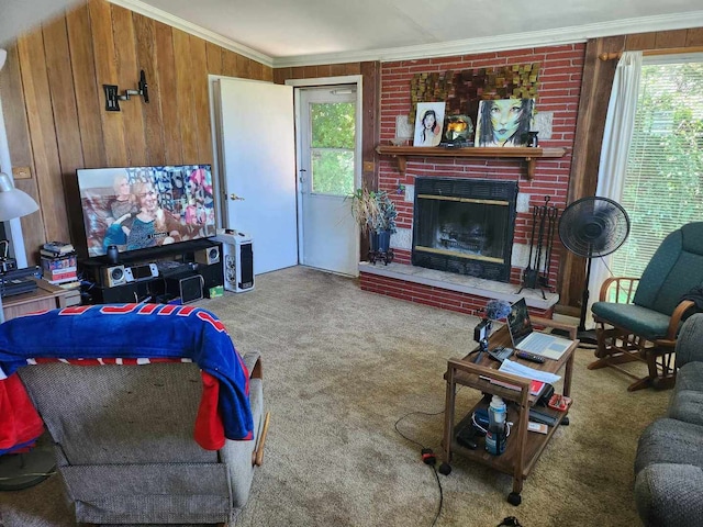 carpeted living room featuring ornamental molding, a brick fireplace, and wooden walls