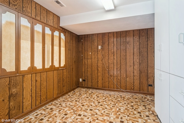 empty room with wood walls