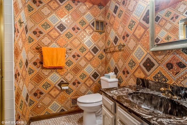 bathroom featuring vanity, toilet, and tile patterned floors