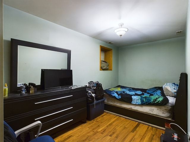 bedroom featuring hardwood / wood-style floors