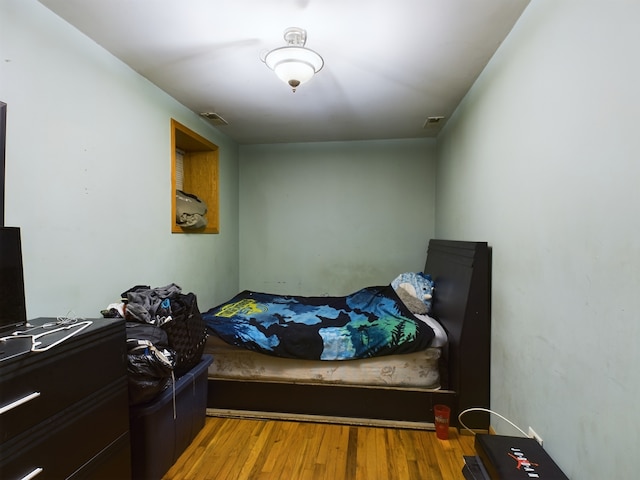 bedroom featuring hardwood / wood-style flooring