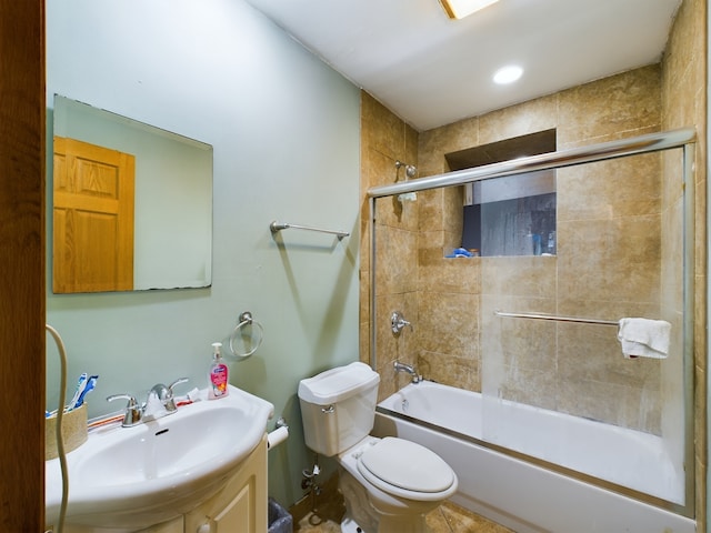 full bathroom with toilet, combined bath / shower with glass door, and vanity