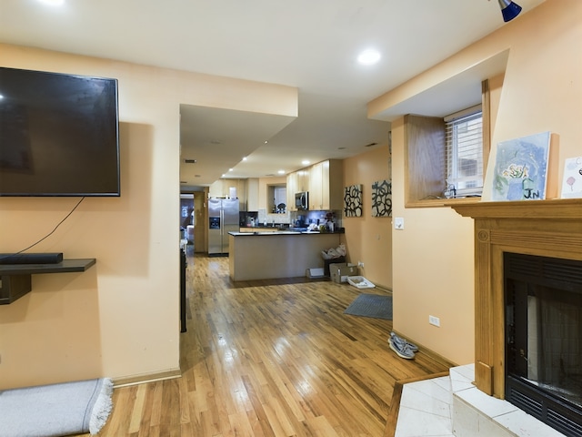 living room with light hardwood / wood-style flooring