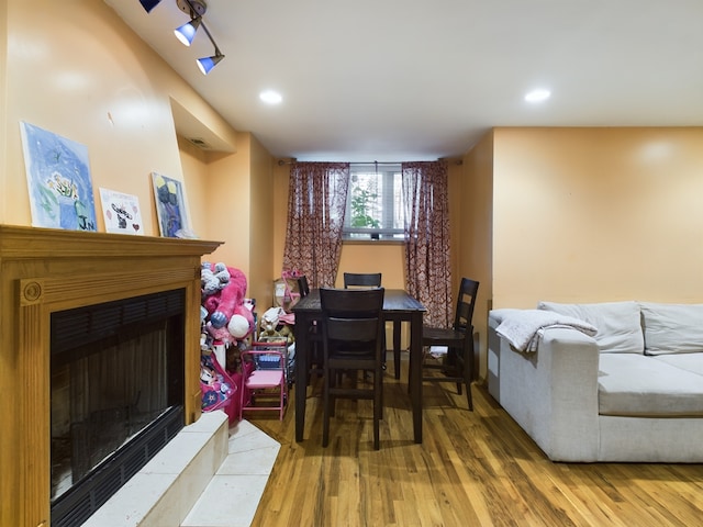 interior space featuring hardwood / wood-style flooring and a skylight