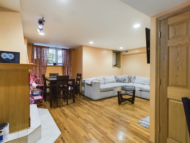 living room with light hardwood / wood-style floors