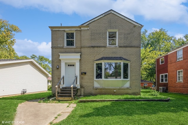 view of front of property with central AC unit and a front lawn