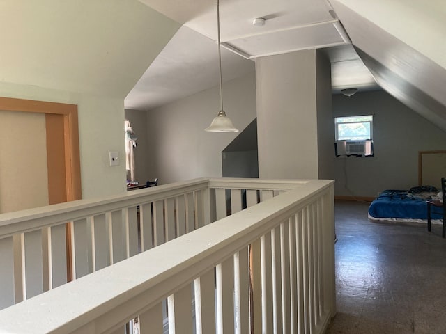 hallway featuring lofted ceiling, cooling unit, and dark hardwood / wood-style flooring