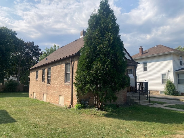 view of home's exterior with a lawn