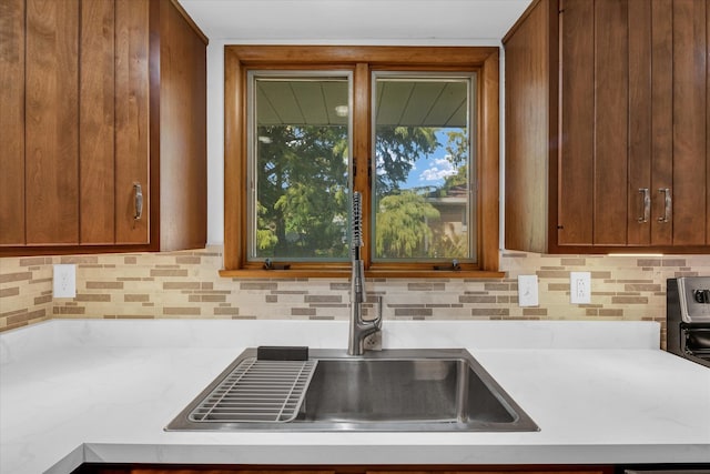 kitchen with decorative backsplash and sink