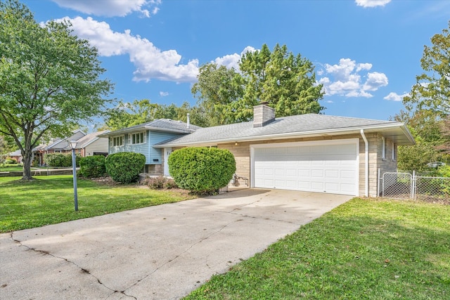 view of front facade featuring a front yard and a garage