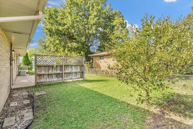 view of yard with a patio and central AC