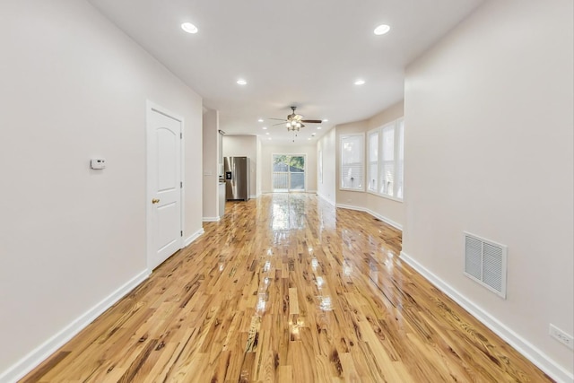 8251 S E End Ave, Chicago, IL 60617 - unfurnished living room with light wood-style floors, recessed lighting, and a ceiling fan