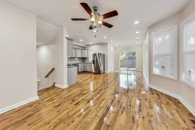 8251 S E End Ave, Chicago, IL 60617 - unfurnished living room featuring ceiling fan, light wood-style floors, and recessed lighting