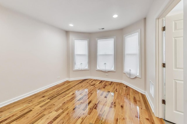 spare room with light wood-type flooring