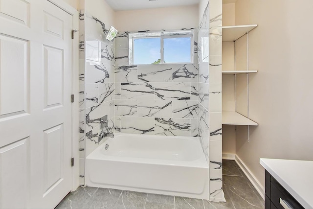 bathroom with tiled shower / bath combo and vanity