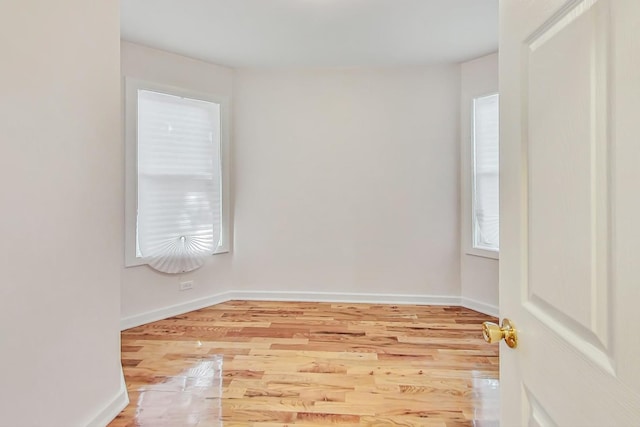 empty room with light hardwood / wood-style floors