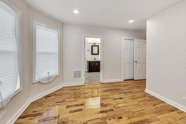 8251 S E End Ave, Chicago, IL 60617 - spare room featuring light wood-type flooring and recessed lighting