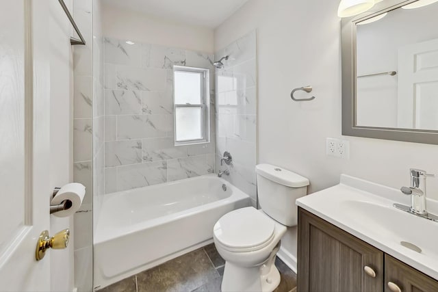 full bathroom featuring tiled shower / bath combo, vanity, toilet, and tile patterned flooring