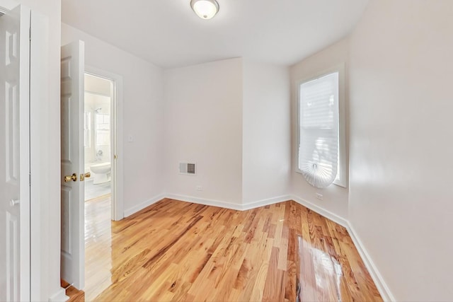 8251 S E End Ave, Chicago, IL 60617 - spare room with light wood-type flooring and baseboards