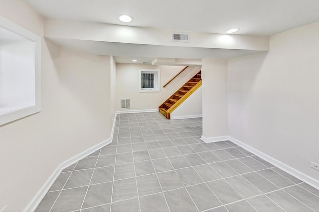 basement with light tile patterned flooring