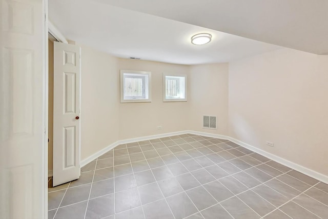 unfurnished room featuring light tile patterned floors