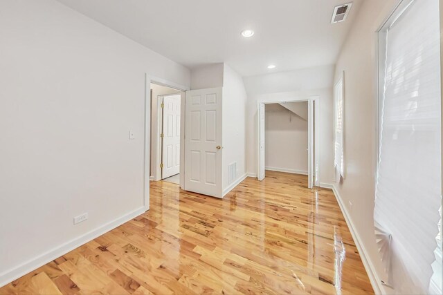 8251 S E End Ave, Chicago, IL 60617 - unfurnished bedroom featuring light wood-style flooring and recessed lighting