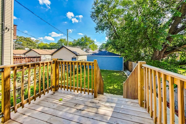 wooden terrace featuring a yard