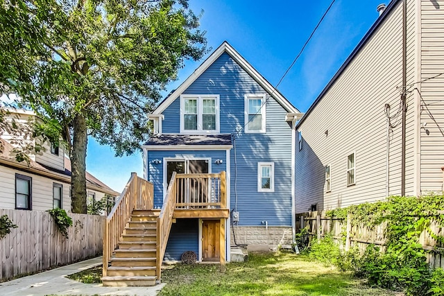 8251 S E End Ave, Chicago, IL 60617 - rear view of house featuring a fenced backyard, a wooden deck, and stairs