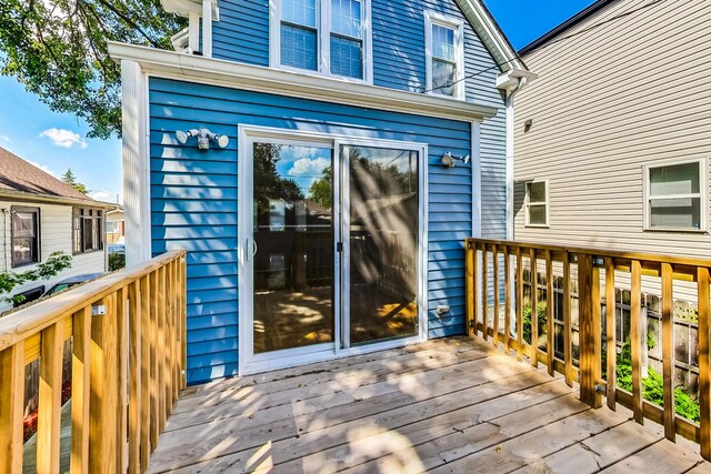 8251 S E End Ave, Chicago, IL 60617 - back of house with a fenced backyard, a deck, and stairway