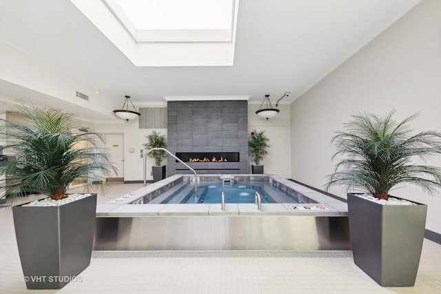 view of swimming pool featuring a fireplace