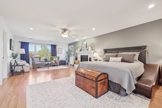 bedroom featuring light hardwood / wood-style floors and ceiling fan