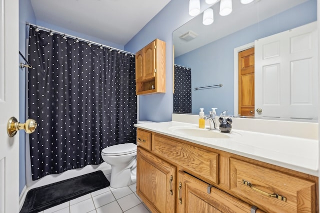 bathroom featuring vanity, walk in shower, tile patterned flooring, and toilet