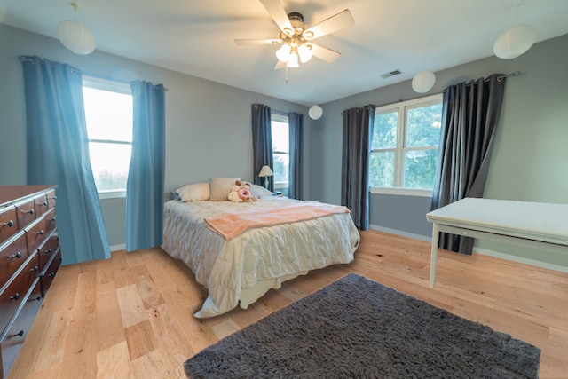 bedroom featuring ceiling fan and light hardwood / wood-style flooring