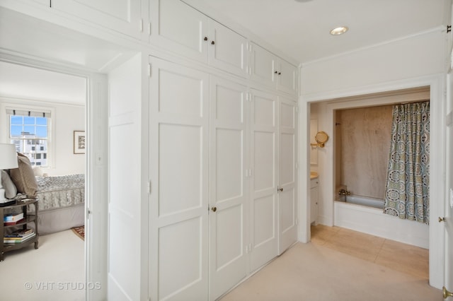 corridor with light tile patterned flooring