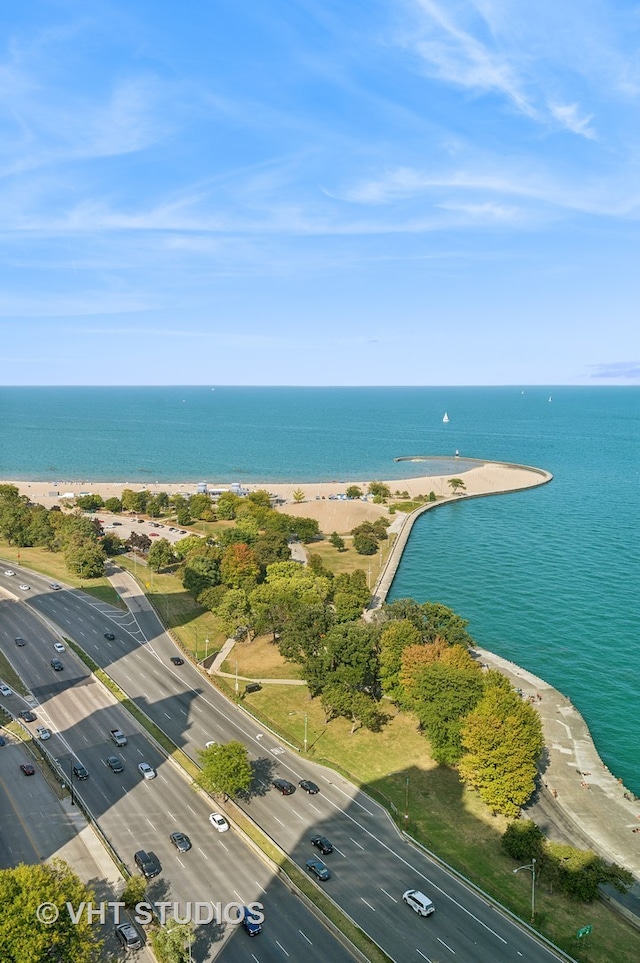 bird's eye view with a water view and a view of the beach