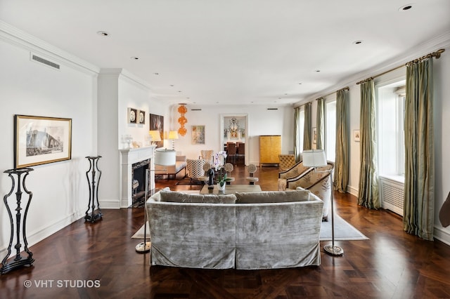 living room featuring dark parquet floors and crown molding