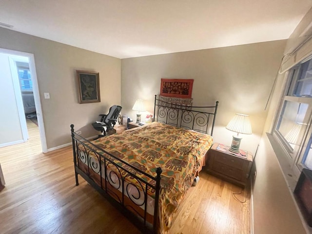 bedroom featuring wood-type flooring