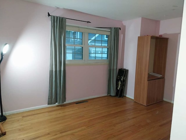 unfurnished bedroom featuring wood-type flooring