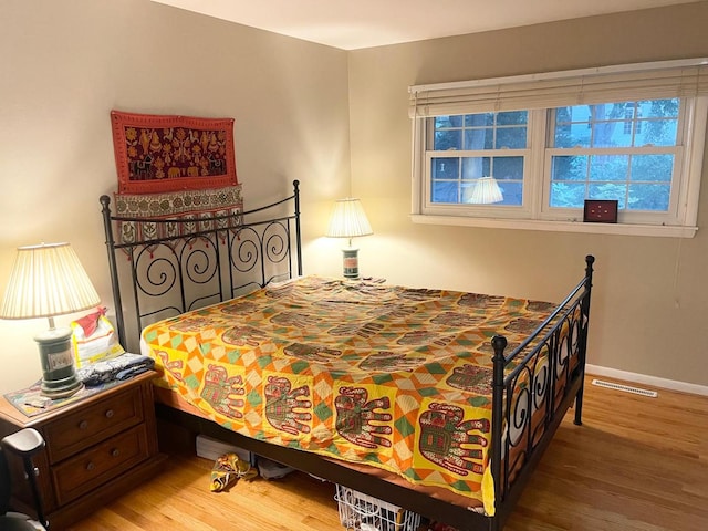 bedroom featuring wood-type flooring