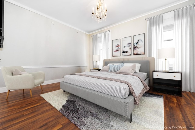 bedroom featuring crown molding, dark hardwood / wood-style flooring, and an inviting chandelier