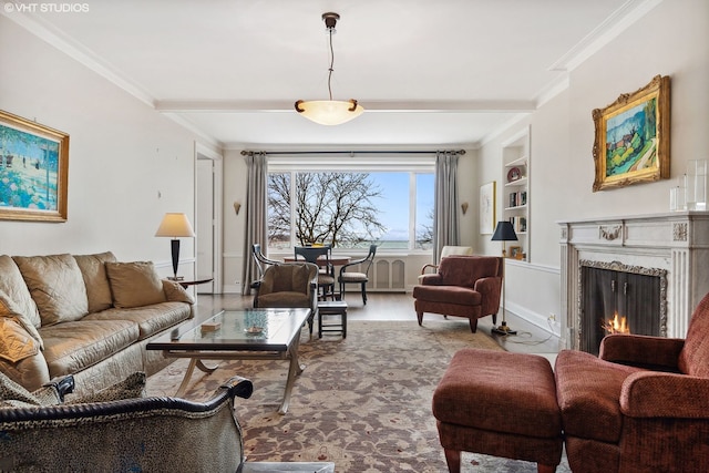 living room with hardwood / wood-style flooring, a fireplace, and crown molding