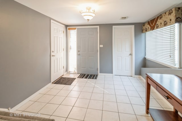 entrance foyer with light tile patterned floors