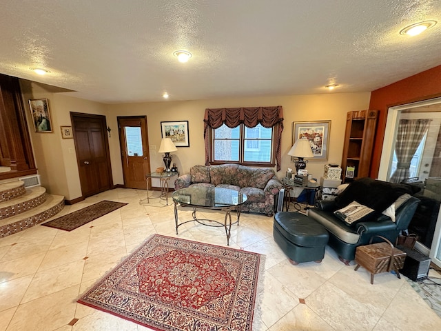 living room with a textured ceiling