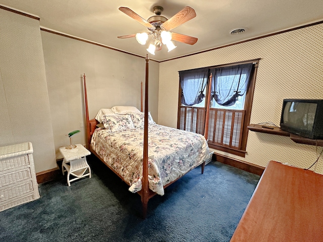 bedroom with ceiling fan, crown molding, and carpet floors