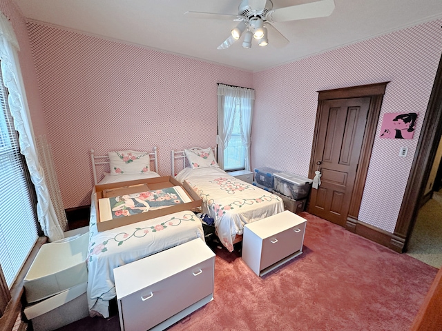 carpeted bedroom with ceiling fan